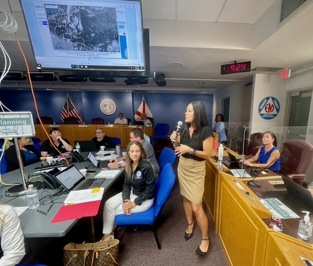 Shannon Weiner (standing), Monroe County Emergency Management Director, oversees an annual hurricane preparedness workshop held at the Emergency Operations Center in Marathon.