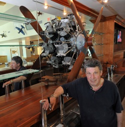 Behind the long bar is a replica 1927 engine that Richmond commissioned, and nearby is an exact model of the plane his father flew in wartime. 