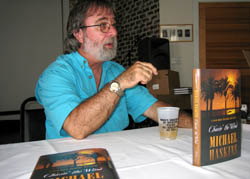 Shown here at a book signing, Michael Haskins set his crime thriller "Chasin' the Wind" in the quirky and charismatic city of Key West. Photo by Paul Clarin