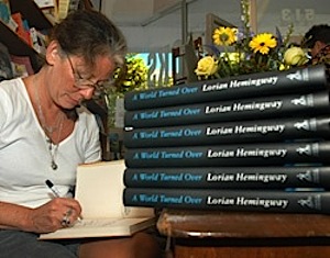 Acclaimed author and short story contest director Lorian Hemingway, is shown here signing copies of her third book, "A World Turned Over." Photo by Andy Newman/Florida Keys News Bureau