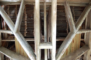 Looking up, inside the singled pine tower.